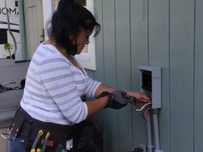 Licensed electrician wiring an exterior subpanel in Moscow